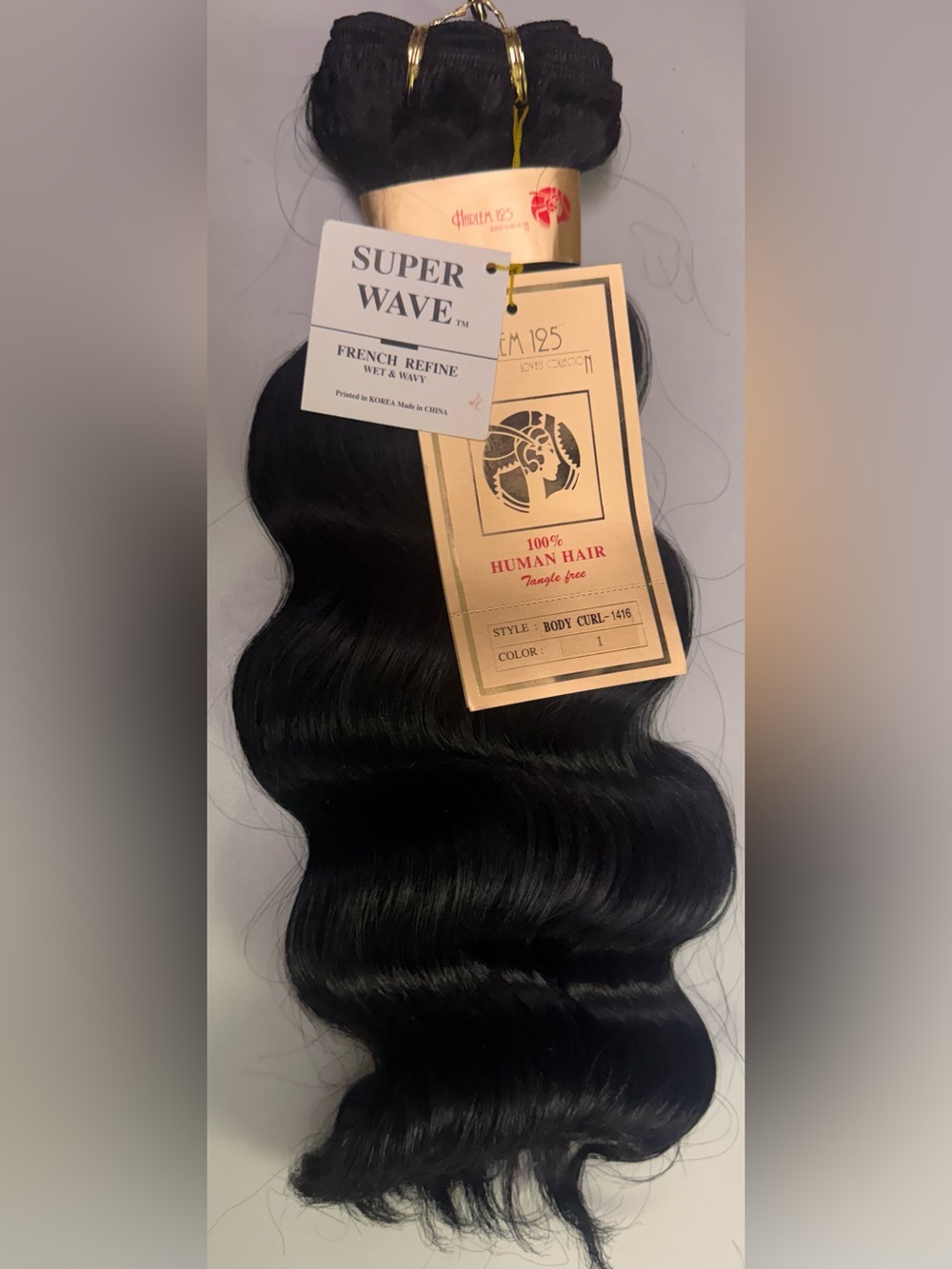 Harlem 125. 100% human hair. Body curl.
